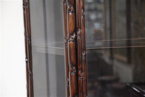 A Chinese glazed hongmu display cabinet, early 20th century, W.98cm D.40cm H.191cm